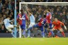 Manchester City's Rico Lewis, left, scores his side's second goal during the English Premier League soccer match between Manchester City and Crystal Palace at the Etihad Stadium in Manchester, England, Saturday, Dec.16, 2023. (AP Photo/Dave Thompson)