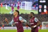 West Ham's Edson Alvarez, left, celebrates with Mohammed Kudus, after scored his side's second goal during the Europa League Group A soccer match between West Ham United and SC Freiburg at the London stadium in London, Thursday, Dec. 14, 2023. (AP Photo/Kirsty Wigglesworth)