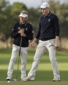 Bernhard Langer, left, and his son Jason, right, putt during the final round of the PNC Championship golf tournament Sunday, Dec. 17, 2023, in Orlando, Fla. (AP Photo/Kevin Kolczynski)