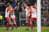 Bayern's Harry Kane, centre, celebrates with teammates after scoring his side's opening goal during the German Bundesliga soccer match between Bayern Munich and Stuttgart in Munich, Germany, Sunday, Dec.17, 2023. (AP Photo/Matthias Schrader)