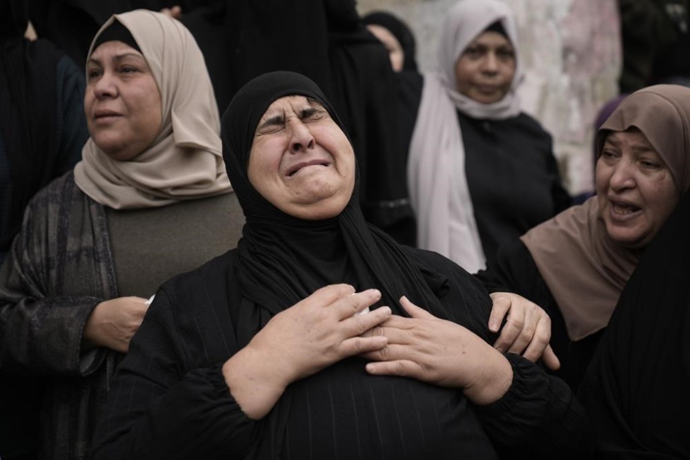 Palestinians attend a funeral of militants killed during Israeli military raid on Nur Shams refugee camp in Tulkarem, West Bank, on Sunday, Dec. 17, 2023. Canada is one of 14 countries that issued a statement of concern over violence in the West Bank, calling on Israel to do more to stop