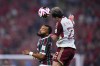 Al Ahly's Emam Ashour jumps for the ball with Fluminense's Samuel Xavier, left, during the Soccer Club World Cup semifinal soccer match between Fluminense FC and Al Ahly FC at King Abdullah Sports City Stadium in Jeddah, Saudi Arabia, Monday, Dec. 18, 2023. (AP Photo/Manu Fernandez)