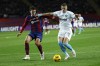 Barcelona's Andreas Christensen, left, and Girona's Artem Dovbyk challenge for the ball during the Spanish La Liga soccer match between Barcelona and Girona at the Olimpic Lluis Companys stadium in Barcelona, Spain, Sunday, Dec. 10, 2023. (AP Photo/Joan Monfort)