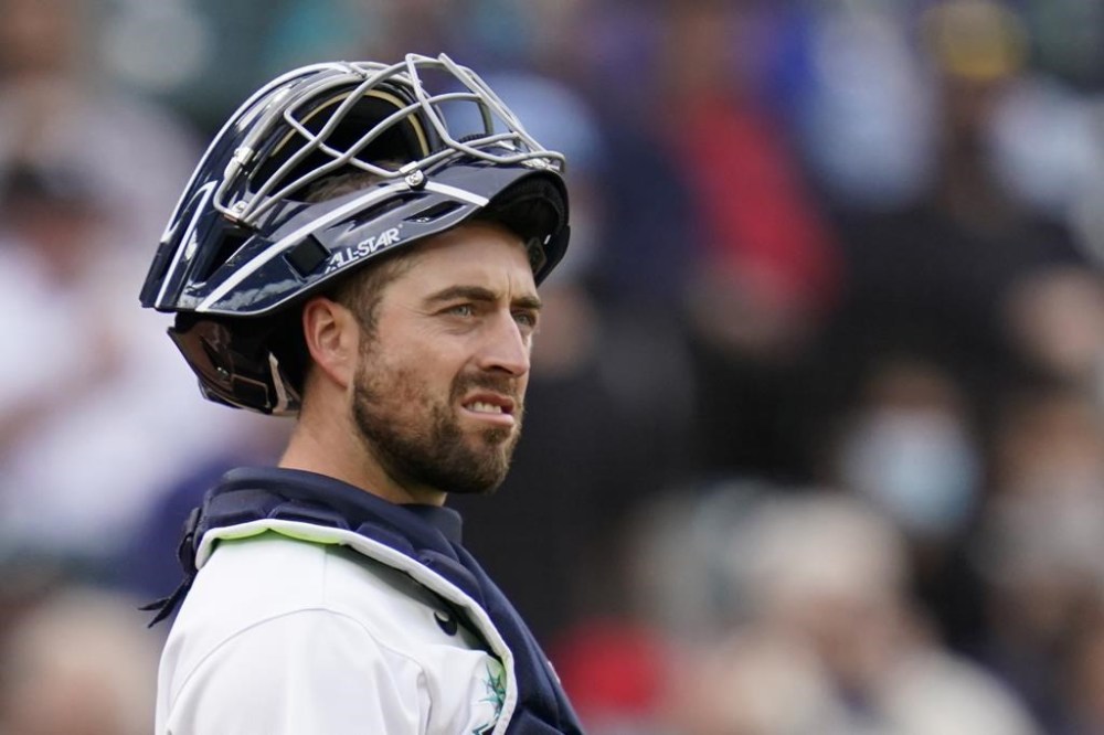 FILE - Seattle Mariners catcher Tom Murphy stands on the field during a baseball game against the Boston Red Sox, Sept. 15, 2021, in Seattle. Murphy and the San Francisco Giants have agreed on an $8 million, two-year contract, according to a person with direct knowledge of the negotiations. (AP Photo/Elaine Thompson, File)