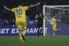 Frosinone's Giuseppe Caso, right, celebrates scoring his side's second goal of the game during the Italian Cup soccer match between Napoli and Frosinone at the Diego Armando Maradona stadium in Naples, Italy, Tuesday, Dec. 19, 2023. (Alessandro Garofalo/LaPresse via AP)