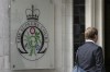 FILE - A man enters the Supreme Court in London, on Oct. 9, 2023. An artificial intelligence system can't be registered as the inventor of a patent, Britain's Supreme Court ruled on Wednesday Dec. 20, 2023 in a decision denying machines the same status as humans. (AP Photo/Kin Cheung, File)