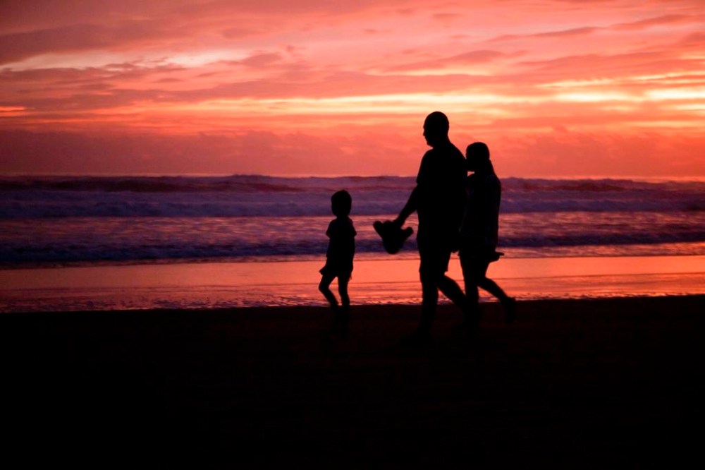Though the forecast looks favourable, airports and airlines are gearing up for the prospect of mucked-up travel as the holidays approach, ramping up staffing and flight schedules, readying updated facilities and doling out advice to passengers. People walk on the beach in Lazaro Cardenas, Mexico, Sunday, Oct. 24, 2021. THE CANADIAN PRESS/AP-Armando Solis