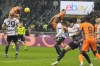 Inter Milan's Carlos Augusto, right, scores during an Italian Cup round of 16 soccer match between Inter Milan and Bologna, at the San Siro stadium in Milan, Italy, Wednesday, Dec. 20, 2023. (AP Photo/Luca Bruno)