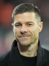 Leverkusen's head coach Xabi Alonso smiles prior the start of the German Bundesliga soccer match between Bayer Leverkusen and VfL Bochum at the BayArena in Leverkusen, Germany, Wednesday, Dec. 20, 2023. (AP Photo/Martin Meissner)