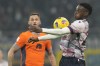 Bologna's Jhon Lucumi controls the ball during an Italian Cup round of 16 soccer match between Inter Milan and Bologna, at the San Siro stadium in Milan, Italy, Wednesday, Dec. 20, 2023. (AP Photo/Luca Bruno)