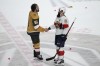 Vegas Golden Knights Mark Stone (61), left, and Florida Panthers Radko Gudas (7) shake hands after Vegas won the Stanley Cup in Game 5 of the NHL hockey Stanley Cup Finals Tuesday, June 13, 2023, in Las Vegas. The governing body for amateur hockey in Newfoundland and Labrador has banned end-of-game handshakes. A post today on Hockey NL's website says there have been 