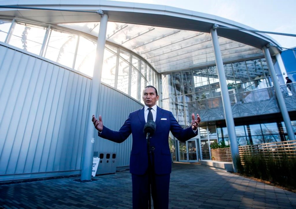 Manitoba Premier Wab Kinew speaks to media in Winnipeg on Wednesday, Oct. 18, 2023. He says expropriating buildings from problem landlords — and fixing them up — would help the NDP government meet its target of eliminating chronic homelessness within eight years. THE CANADIAN PRESS/John Woods