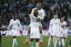 Real Madrid's Antonio Rudiger, centre, and Real Madrid's Jude Bellingham celebrate their victory at the Spanish La Liga soccer match between Alaves and Real Madrid at the Mendizorroza stadium in Vitoria-Gasteiz, Spain, Thursday, Dec. 21, 2023. (AP Photo/Ricardo Larreina)