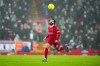 Liverpool's Mohamed Salah goes for the ball during the English League Cup quarterfinal soccer match between Liverpool and West Ham United at the Anfield stadium in Liverpool, England, Wednesday, Dec. 20, 2023. (AP Photo/Jon Super)