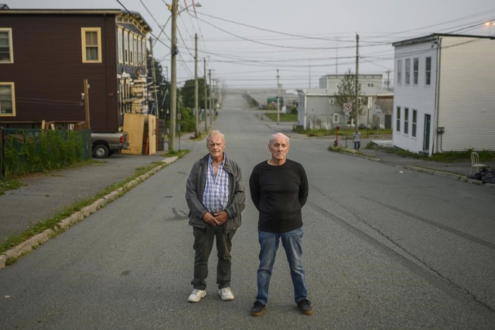 Walter (Wally) Gillespie, left, and Robert (Bobby) Mailman pose in the south end neighbourhood where they grew up in Saint John, N.B., Tuesday, Aug. 18, 2020. THE CANADIAN PRESS/Darren Calabrese