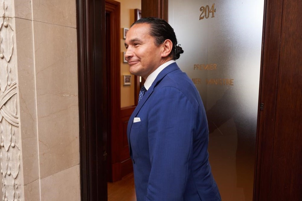 The Manitoba government is planning to take a step in the coming weeks towards its plan for a universal school meal program. Premier Wab Kinew says the government is putting up $1.5 million to eliminate a wait list at the Child Nutrition Council of Manitoba for the remainder of the current school year. Kinew walks to the premier's office in Winnipeg, Thursday, Oct. 5, 2023.THE CANADIAN PRESS/David Lipnowski