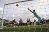Luton Town's Andros Townsend, left, scores their side's first goal of the game during the English Premier League soccer match between Luton Town and Newcastle United at Kenilworth Road, Luton, England, Saturday, Dec. 23, 2023. (Nick Potts/PA via AP)