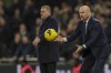 Everton's head coach Sean Dyche throws the ball during the English Premier League soccer match between Tottenham and Everton at Tottenham Hotspur stadium in London, Saturday, Dec. 23, 2023. (AP Photo/Ian Walton)