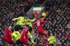 Arsenal's Gabriel, top left, heads the ball to scores his side's opening goal during the English Premier League soccer match between Liverpool and Arsenal at Anfield stadium in Liverpool, England, Saturday, Dec. 23, 2023. (AP Photo/Jon Super)