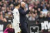 Manchester United's head coach Erik ten Hag talks to Manchester United's Sergio Reguilon during the English Premier League soccer match between West Ham United and Manchester United at the London stadium in London, Saturday, Dec. 23, 2023. (AP Photo/Kirsty Wigglesworth)