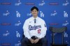 Los Angeles Dodgers' Shohei Ohtani answers questions during a baseball news conference at Dodger Stadium Thursday, Dec. 14, 2023, in Los Angeles. (AP Photo/Ashley Landis)