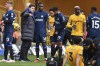 Chelsea's head coach Mauricio Pochettino speaks with Chelsea's Lesley Ugochukwu during the English Premier League soccer match between Wolverhampton Wanderers and Chelsea at Molineux stadium in Wolverhampton, England, Sunday, Dec. 24, 2023. (AP Photo/Rui Vieira)