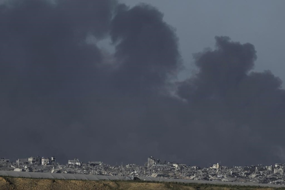 Smoke rises following an Israeli bombardment in the Gaza Strip, as seen from southern Israel, Tuesday, Dec. 26, 2023. The army is battling Palestinian militants across Gaza in the war ignited by Hamas' Oct. 7 attack into Israel. (AP Photo/Leo Correa)
