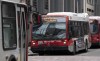OC Transpo buses line up along a street in Ottawa on Thursday, April 16, 2020. THE CANADIAN PRESS/Adrian Wyld