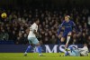 Chelsea's Mykhailo Mudryk, centre, jumps a tackle by Crystal Palace's Michael Olise during an English Premier League soccer match between Chelsea and Crystal Palace at Stamford Bridge in London, Wednesday, Dec. 27, 2023. (AP Photo/Alastair Grant)