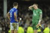 Everton's goalkeeper Jordan Pickford, right, and Everton's James Tarkowski after being defeated by Manchester City during the English Premier League soccer match between Everton and Manchester City at Goodison Park stadium in Liverpool, England, Wednesday, Dec. 27, 2023. (AP Photo/Jon Super)
