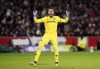 Wolverhampton Wanderers goalkeeper Jose Sa celebrates after team-mate Mario Lemina scores their first goal during the English Premier League soccer match between Wolverhampton Wanderers vs Brentford FC at the Gtech Community Stadium, London, Wednesday Dec. 27, 2023. (John Walton/PA via AP)
