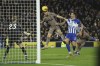 Tottenham's Ben Davies, center, scores his side's second goal during the English Premier League soccer match between Brighton & Hove Albion and Tottenham Hotspur at the Amex stadium in Brighton, England, Thursday, Dec. 28, 2023. (AP Photo/Ian Walton)