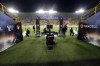 Soccer fans, background, and security personnel wait for the Super Cup match between Galatasaray and Fenerbahce at Al Awal Park in Riyadh, Saudi Arabia, Friday, Dec. 29, 2023. The Turkish Super Cup final to be played in Saudi Arabia on Friday was canceled after a dispute with Saudi authorities over the players' jerseys, Turkish media reported. (Murat Akbas/Dia Images via AP)