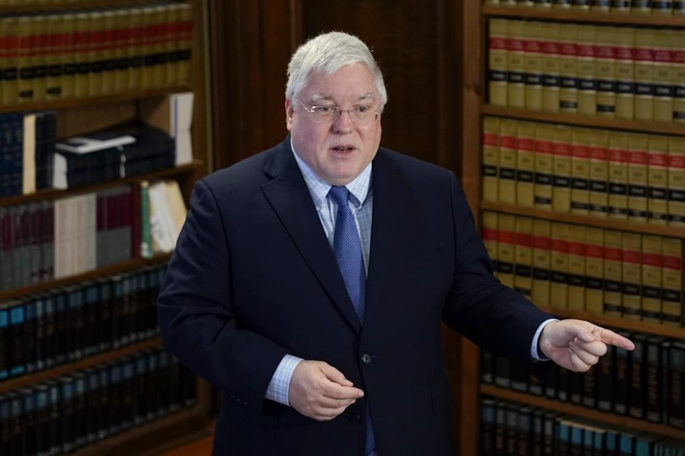 FILE - West Virginia Attorney General Patrick Morrisey speaks with reporters to announce a $68 million settlement with the Kroger pharmacy chain over its role in perpetuating the opioid crisis, during a news conference at the state Capitol in Charleston, W.Va., May 4, 2023. West Virginia is issuing the first checks from a fund established by the settlement of opioid lawsuits in the state, which has by far the nation’s highest drug overdose death rate. (AP Photo/Jeff Dean, File)