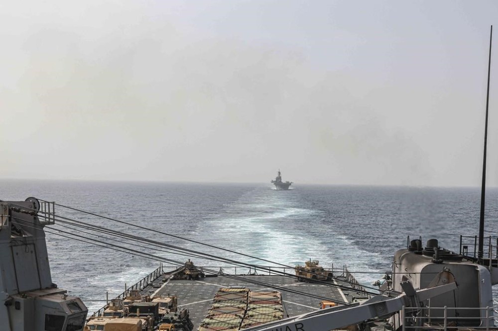 In this image provided by the U.S. Navy, the amphibious dock landing ship USS Carter Hall and amphibious assault ship USS Bataan transit the Bab al-Mandeb strait on Aug. 9, 2023. (Mass Communications Spc. 2nd Class Moises Sandoval/U.S. Navy via AP)