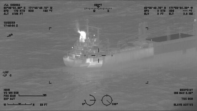 This image provided by the U.S. Coast Guard shows a reported fire aboard the 410-foot cargo vessel Genius Star XI, approximately 200 miles southwest of Dutch Harbor, Alaska on Thursday, Dec. 29, 2023. The large cargo ship with a fire in its hold is being kept 2 miles (3.22 kilometers) offshore of an Alaska port as a precaution while efforts are undertaken to extinguish the flames, the U.S. Coast Guard said Saturday. (Lt.Cmdr. Michael Salerno/U.S. Coast Guard via AP)