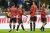 AC Milan's Christian Pulisic, 2nd left, celebrates with Ruben Loftus-Cheek after scoring the opening goal during the Serie A soccer match between AC Milan and Sassuolo at the San Siro stadium, in Milan, Italy, Saturday, Dec. 30, 2023. (AP Photo/Antonio Calanni)