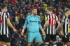 Newcastle's goalkeeper Martin Dubravka, center, reacts after a save penalty during the English Premier League soccer match between Liverpool and Newcastle, at Anfield stadium in Liverpool, England, Monday, Jan. 1, 2024. (AP Photo/Jon Super)