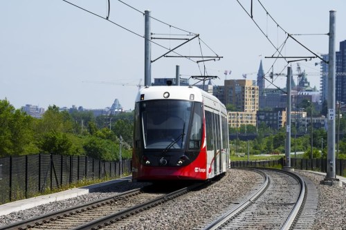 An Ottawa Light Rail Transit (OLRT) train travels along the tracks in Ottawa on Wednesday, June 22, 2022. The new year brings no fresh start for Ottawa's ill-fated light rail train system after concrete debris was found on the tracks of an LRT station tunnel.THE CANADIAN PRESS/Sean Kilpatrick