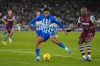 Brighton's Joao Pedro, left, duels for the ball with West Ham's Angelo Ogbonna during the English Premier League soccer match between West Ham and Brighton, at the London stadium in London, Tuesday, Jan. 2, 2024. (AP Photo/Kirsty Wigglesworth)
