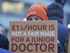Junior doctors and members of the British Medical Association (BMA) demonstrate outside St Thomas' Hospital, London, Wednesday, Jan. 3, 2024, as they take to picket lines for six days. Doctors in the early stages of their careers in England have started a 72-hour strike in their long-running dispute over pay levels. (Jonathan Brady/PA via AP)