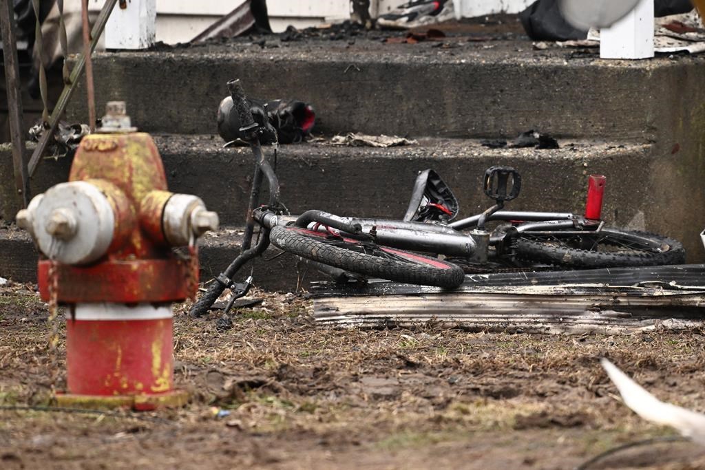 Four children killed as a fire tears through a multifamily home in ...