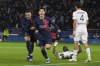PSG's Lee Kang-in, center, celebrates with teammate Kylian Mbappe, after scoring his side's first goal, during the French Super Cup final soccer match between Toulouse and Paris Saint-Germain at the Parc des Princes in Paris, Wednesday, Jan. 3, 2024. (AP Photo/Michel Euler)