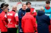 Cologne's new coach Timo Schultz, center, speaks to his team as he attends the first training session in Cologne, Germany, Thursday, Jan. 4, 2024. Cologne has appointed Schultz as coach in a bid to climb away from the Bundesliga relegation zone. (Federico Gambarini/dpa via AP)