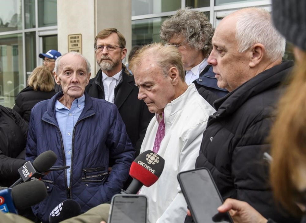 Robert Mailman, left, and Walter Gillespie, speak to media shortly after their hearing at Saint John Law Courts in Saint John, N.B., January 4, 2024. The two men recently had a 1984 murder conviction overturned and have now been found formally not guilty. THE CANADIAN PRESS/Michael Hawkins