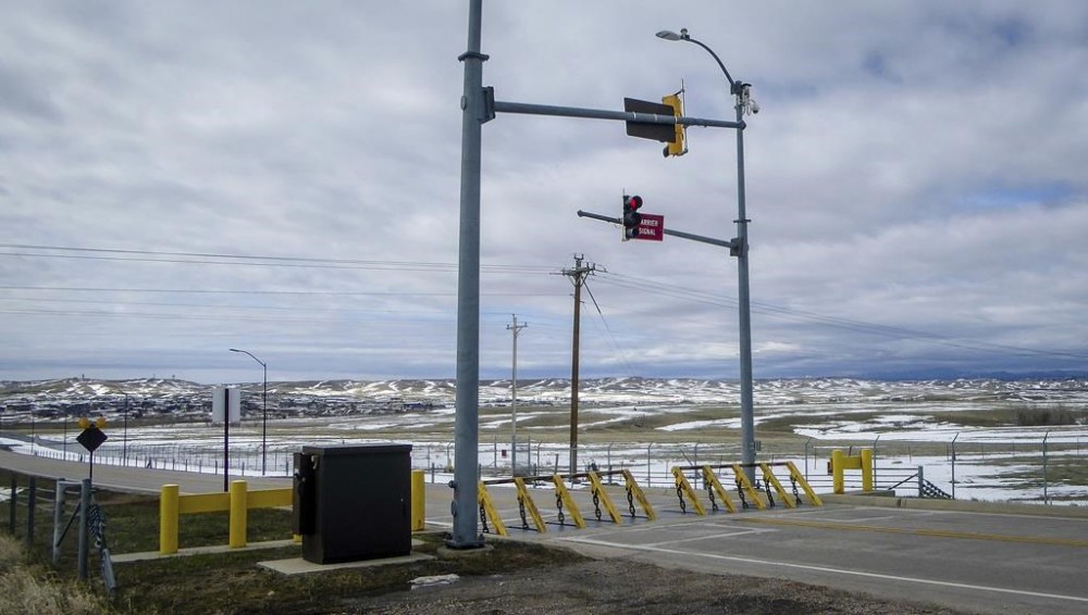 FILE - An emergency vehicle barrier stands at Ellsworth Air Force Base in Rapid City, S.D. A B-1 Lancer bomber from the base crashed Thursday, Jan. 4, 2024, with all four of its crew members ejecting, the Air Force said. (Arielle Zionts /Rapid City Journal via AP)
