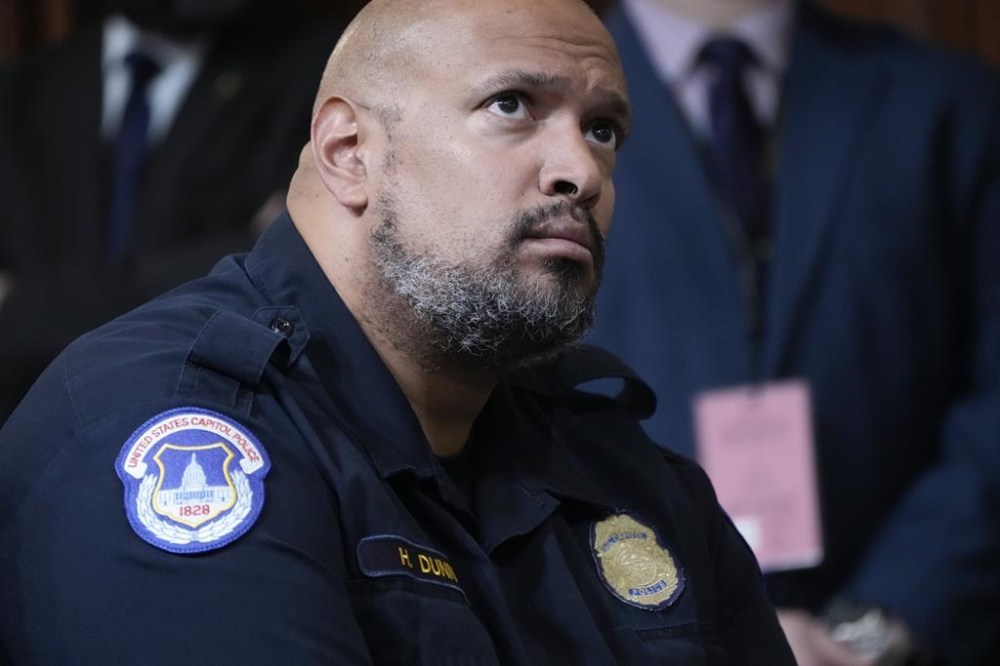 FILE - U.S. Capitol Police Sgt. Harry Dunn listens as the House select committee investigating the Jan. 6 attack on the U.S. Capitol holds its final meeting on Capitol Hill in Washington, Monday, Dec. 19, 2022. Dunn, who defended the U.S. Capitol on Jan. 6 announced Wednesday, Jan. 3, 2024 he is running for Congress in Maryland. (AP Photo/Jacquelyn Martin, File)