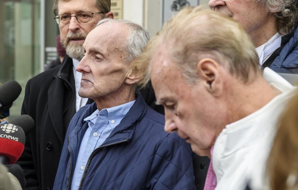 The chief justice of New Brunswick's Court of King's Bench is apologizing to two men who served lengthy prison sentences for a murder the didn't commit. Robert Mailman, left, and Walter Gillespie, speak to media shortly after their hearing at Saint John Law Courts in Saint John, Thursday, Jan. 4, 2024. THE CANADIAN PRESS/Michael Hawkins