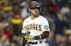 FILE - San Diego Padres' Austin Nola reacts after a strike out in the fifth inning during a baseball game against the Boston Red Sox on Saturday, May 20, 2023, in San Diego. Nola has agreed to a minor league deal with the Milwaukee Brewers that includes an invitation to their major league camp. (AP Photo/Brandon Sloter, File)