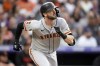 FILE - San Francisco Giants' Mitch Haniger (17) runs down the baseline in the third inning of a baseball game Tuesday, June 6, 2023, in Denver. Haniger returned to the Seattle Mariners when he was acquired from the Giants on Friday, Jan. 5, 2023, with right-hander Anthony DeSclafani and $6 million for left-hander Robbie Ray in a trade of underperforming players coming off injuries. (AP Photo/David Zalubowski, File)